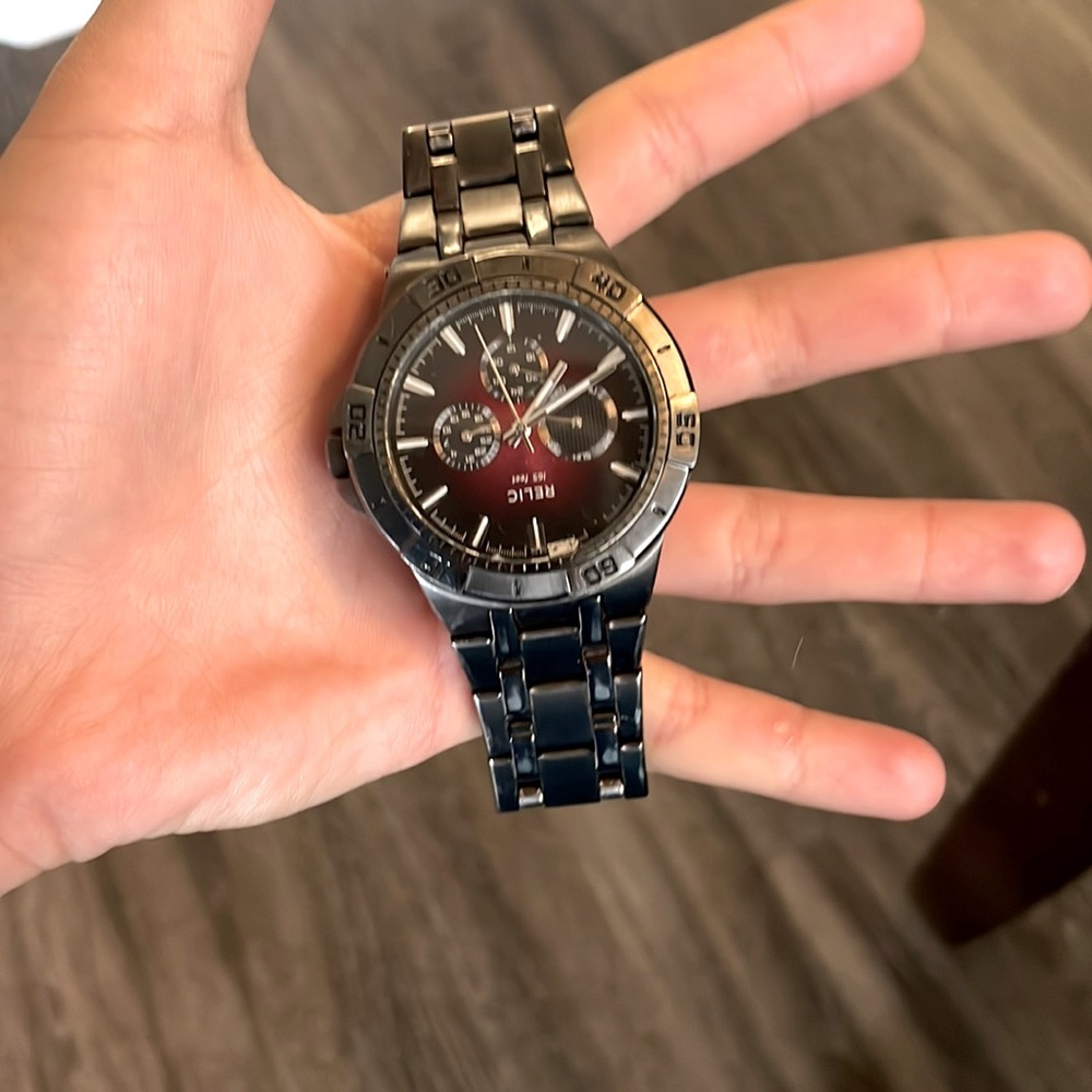 This is a relic watch it is gray and black